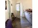 Home entryway with hardwood floors, open door, and side table at 142 3Rd Ave, China Grove, NC 28023