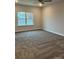 Spacious bedroom with plush carpeting and large window at 103 High Rock Ct # 11, Statesville, NC 28677