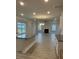 Open kitchen with granite countertops, white cabinets, and a large island at 103 High Rock Ct # 11, Statesville, NC 28677