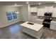 Modern kitchen with white cabinets and island at 111 High Rock Ct # 10, Statesville, NC 28677