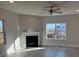 Living room with fireplace, large windows, and hardwood floors at 121 High Rock Ct # 08, Statesville, NC 28677