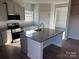 Modern kitchen with gray cabinets, granite island and stainless steel appliances at 186 Mountain Island Dr # 12, Statesville, NC 28677