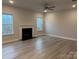 Living room with hardwood floors, fireplace, and neutral color palette at 192 Mountain Island Dr # 13, Statesville, NC 28677