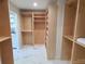 Spacious walk-in closet offering shelves and hanging rods at 902 N Ashe Ave, Newton, NC 28658