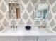 Spa-like bathroom with double vanity and unique wallpaper at 902 N Ashe Ave, Newton, NC 28658