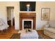Living room fireplace with decorative mantle and hearth at 902 N Ashe Ave, Newton, NC 28658
