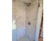 Walk-in shower with marble tile and rain shower head at 902 N Ashe Ave, Newton, NC 28658