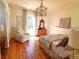 Bright bedroom with hardwood floors and antique dresser at 902 N Ashe Ave, Newton, NC 28658