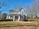 Two-story home with front porch and mature landscaping at 902 N Ashe Ave, Newton, NC 28658