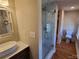 Bathroom with walk-in shower and geometric tile at 902 N Ashe Ave, Newton, NC 28658