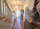 Bright entryway with hardwood floors, staircase, and decorative accents at 902 N Ashe Ave, Newton, NC 28658