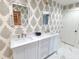 Updated bathroom with double vanity, marble floors and elegant mirrors at 902 N Ashe Ave, Newton, NC 28658