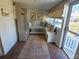 Inviting entryway with built-in bench seating and brick flooring at 902 N Ashe Ave, Newton, NC 28658