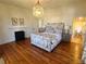 Bedroom with hardwood floors, fireplace and en-suite bathroom at 902 N Ashe Ave, Newton, NC 28658