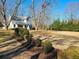 Charming house with a spacious yard, surrounded by mature trees at 902 N Ashe Ave, Newton, NC 28658