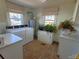 Laundry room with washer, dryer, and brick flooring at 902 N Ashe Ave, Newton, NC 28658