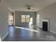 Bright living room with hardwood floors, fireplace, and access to a deck at 117 High Rock Ct # 09, Statesville, NC 28677