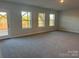 Finished basement with carpeting, windows, and exterior access at 125 High Rock Ct # 07, Statesville, NC 28677