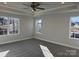 Bright bedroom with carpet, ceiling fan, and multiple windows at 125 High Rock Ct # 07, Statesville, NC 28677