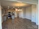 Kitchen and dining area with hardwood floors and modern cabinets at 125 High Rock Ct # 07, Statesville, NC 28677