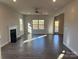 Spacious living room with hardwood floors, fireplace, and large windows at 125 High Rock Ct # 07, Statesville, NC 28677