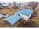 Aerial view of a single-wide mobile home on a large lot with mature trees and a carport at 3430 Potneck Rd, Salisbury, NC 28147