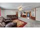 Open living room with leather couches, view into kitchen and dining area at 3430 Potneck Rd, Salisbury, NC 28147