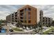 Modern apartment building exterior with parking at 9901 Benfield Rd # 109, Charlotte, NC 28269