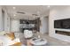 Open living room with modern kitchen and fireplace at 9901 Benfield Rd # 109, Charlotte, NC 28269