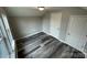 Bright bedroom with grey walls, wood-look flooring, and two closets at 108 Lee Dr, Shelby, NC 28150