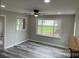 Spacious living area with gray flooring and multiple windows at 108 Lee Dr, Shelby, NC 28150