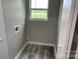 Small laundry room with vinyl flooring and a window at 108 Lee Dr, Shelby, NC 28150