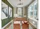 Bright home office with wood desk and green accent wall at 4819 Wolf Pond Rd, Monroe, NC 28112
