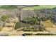 Aerial view of property showing land with pond at 4819 Wolf Pond Rd, Monroe, NC 28112