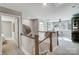 Upstairs hallway with access to bedrooms and a loft area at 4819 Wolf Pond Rd, Monroe, NC 28112