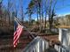 Pond view from deck with flag at 7100 Ridge Lane Rd, Charlotte, NC 28262