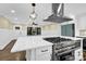 Modern kitchen with stainless steel appliances and a large island at 533 Amon Ln, Pineville, NC 28134