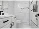 Modern bathroom with white vanity and marble tile at 533 Amon Ln, Pineville, NC 28134