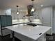 Modern kitchen with large island, stainless steel appliances, and hardwood floors at 533 Amon Ln, Pineville, NC 28134