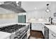 Modern kitchen with stainless steel appliances and white cabinetry at 533 Amon Ln, Pineville, NC 28134