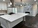 Modern kitchen with large island and marble fireplace at 533 Amon Ln, Pineville, NC 28134
