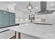 Kitchen island with white quartz countertop and pendant lighting at 533 Amon Ln, Pineville, NC 28134