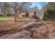 Long driveway leading to a brick ranch house at 1095 Mount Ulla Hwy, Mooresville, NC 28115