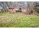 Brick ranch house on a grassy lot with trees at 1095 Mount Ulla Hwy, Mooresville, NC 28115