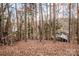 Secluded cabin nestled in the woods near a lake at 156 Beaten Path Rd, Mooresville, NC 28117