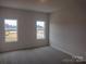 Spacious bedroom with neutral walls and carpeting at 4225 S New Hope Rd # 9, Cramerton, NC 28032