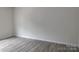 Empty bedroom with grey laminate flooring at 4225 S New Hope Rd # 9, Cramerton, NC 28032