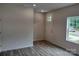 Bright entryway with wood-look flooring and a white door at 4225 S New Hope Rd # 9, Cramerton, NC 28032