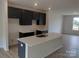 Modern kitchen with dark cabinets, white countertops, and an island at 4225 S New Hope Rd # 9, Cramerton, NC 28032