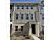 Two-story townhome with neutral siding and multiple windows at 4225 S New Hope Rd # 9, Cramerton, NC 28032